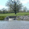A view of pond and waterfall on the 6th hole at Oakhaven Golf Club