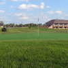 A view of the 1st green with clubhouse in background at Little Bear Golf Club