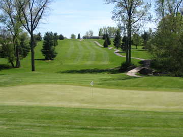 A view of hole #10 with cart path on the right and clubhouse in background at Saint Albans Golf Club green from tee box at Saint Albans Golf Club