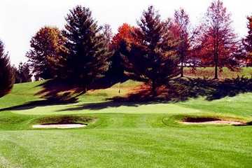 A view of green protected by bunkers at Pine Hill Golf Course